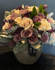 Bouquet of flowers with a 'GRAD' banner on a dark background