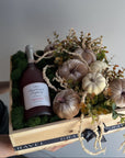 Bottle of Rossetti champagne in a decorative box with pumpkins and greenery