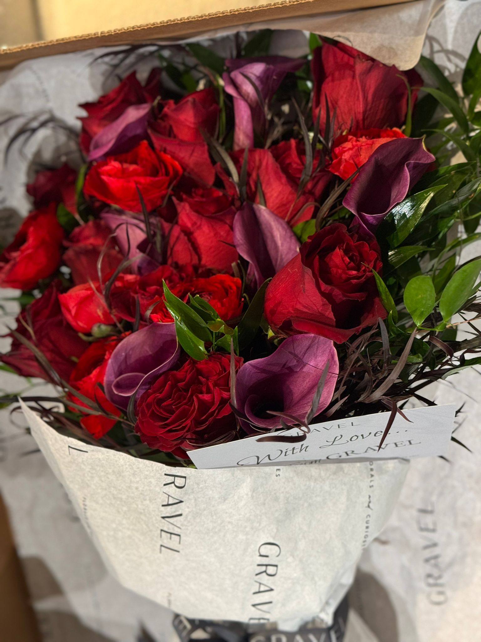 Red Freedom Roses, Purple Calla Lillies, Red Ranunculus, Agonis, and Italian Rucus Bouquet - Nationwide Shipping