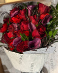 Red Freedom Roses, Purple Calla Lillies, Red Ranunculus, Agonis, and Italian Rucus Bouquet - Nationwide Shipping