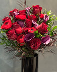 Red Freedom Roses, Purple Calla Lillies, Red Ranunculus, Agonis, and Italian Rucus Bouquet - Nationwide Shipping