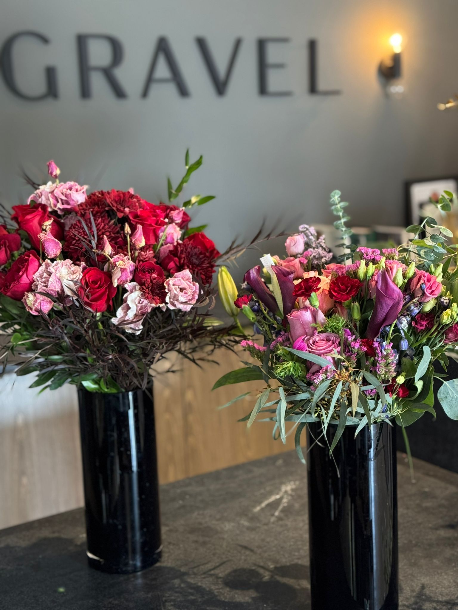 Red Roses, Lisianthus, Red Chrysanthemums, Agonis, and Italian Ruscus Hand Bouquet