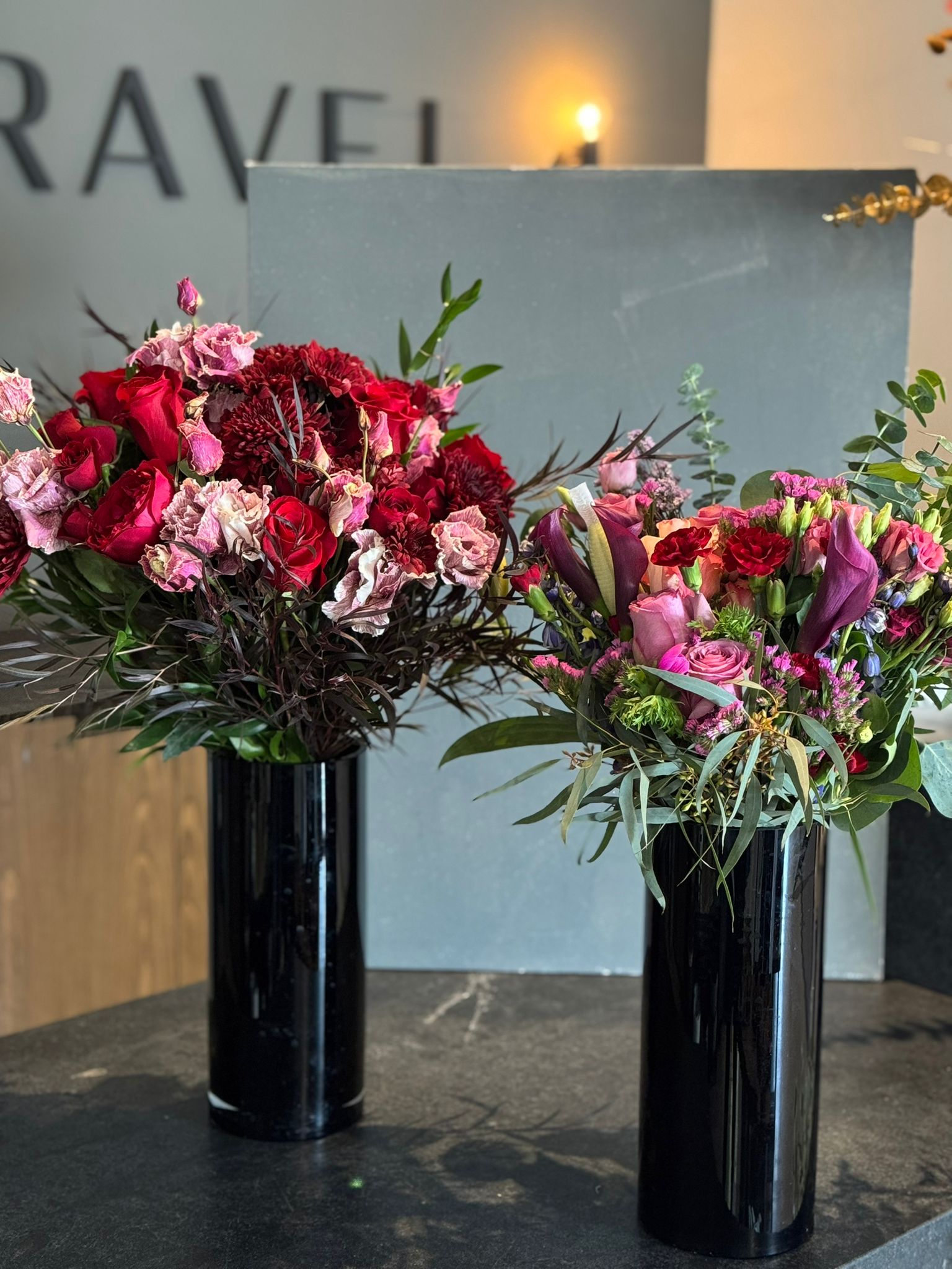 Red Roses, Lisianthus, Red Chrysanthemums, Agonis, and Italian Ruscus Hand Bouquet