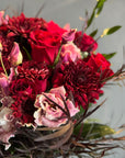 Red Roses, Lisianthus, Red Chrysanthemums, Agonis, and Italian Ruscus Hand Bouquet