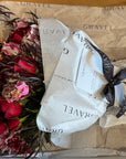 Red Roses, Lisianthus, Red Chrysanthemums, Agonis, and Italian Ruscus Hand Bouquet