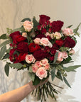 Red and Pink Roses, Ranunculus, and Eucalyptus Bouquet 