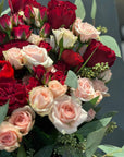 Red and Pink Roses, Ranunculus, and Eucalyptus Bouquet 