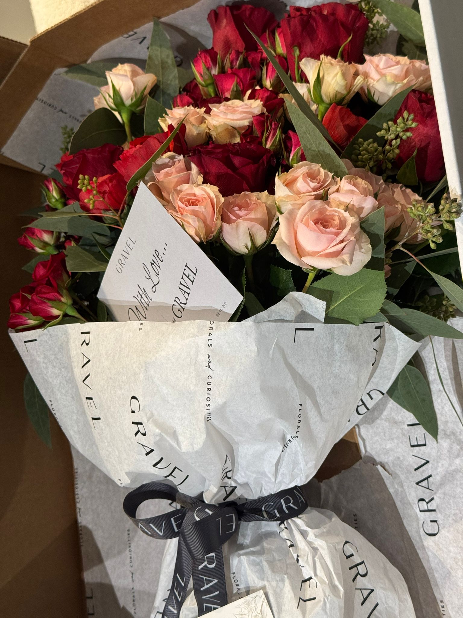 Red and Pink Roses, Ranunculus, and Eucalyptus Bouquet 