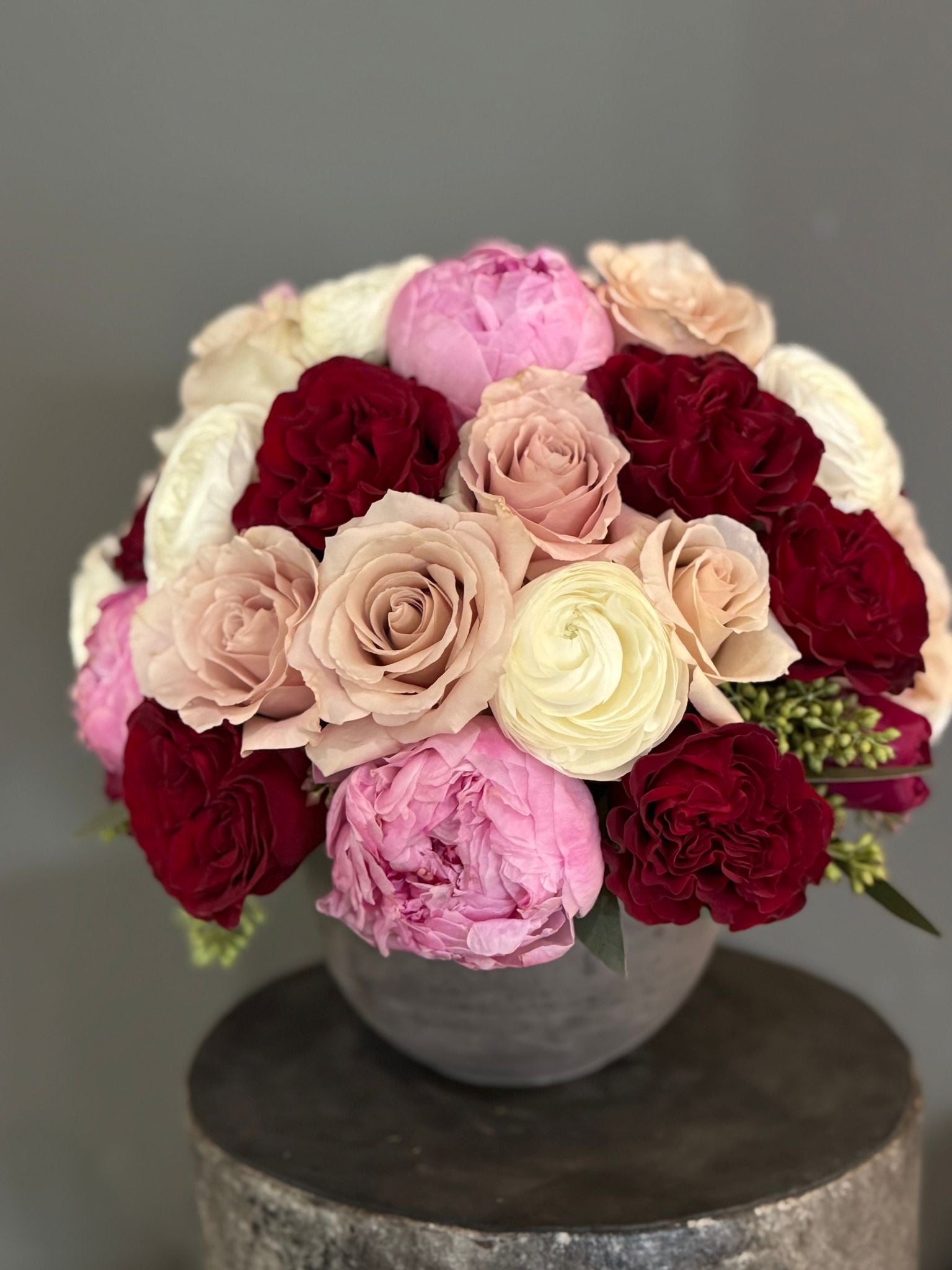 The Astrid - Pink Peonies, Red Roses, Ranunculus, and Quicksand Roses