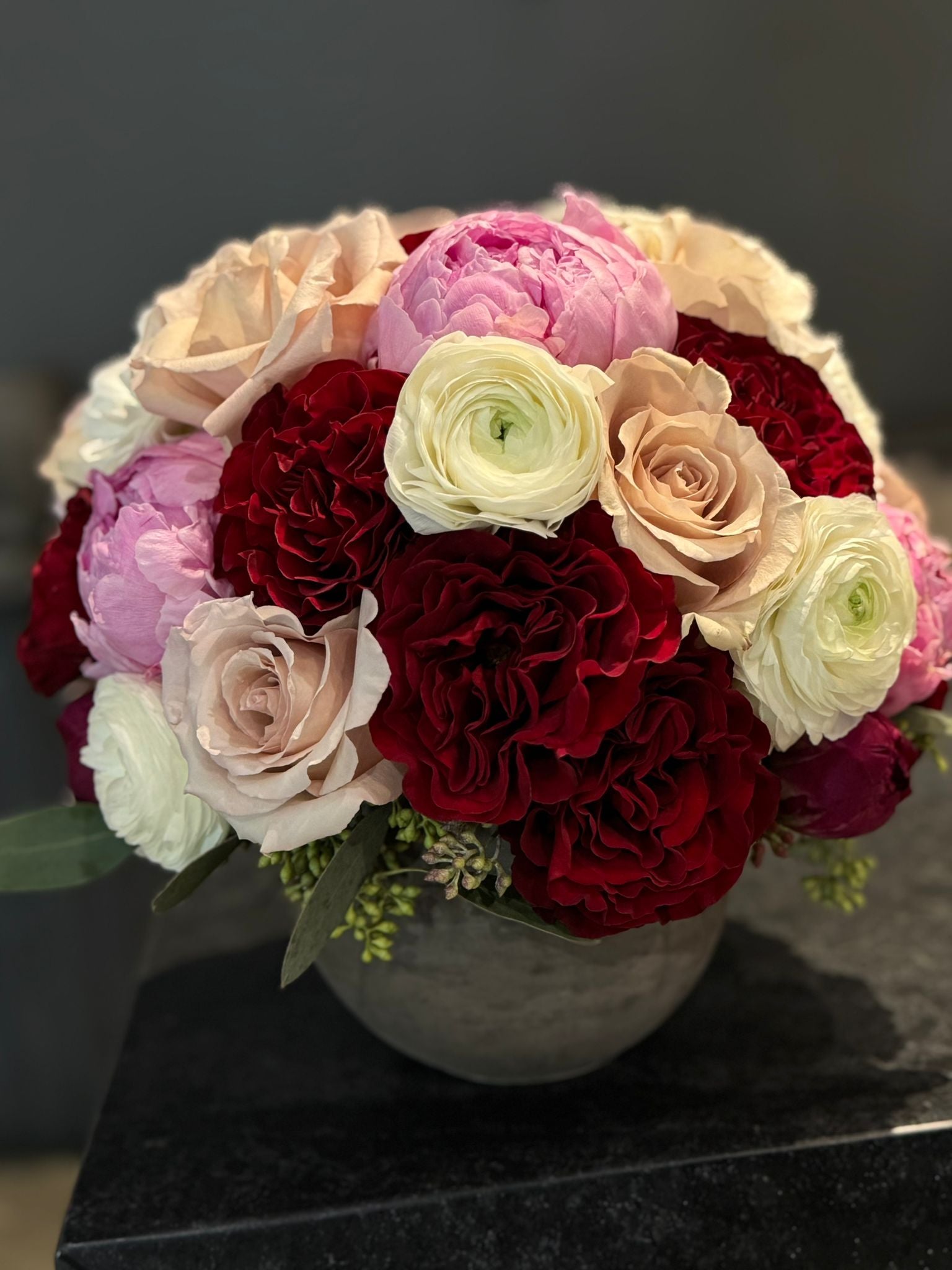 The Astrid - Pink Peonies, Red Roses, Ranunculus, and Quicksand Roses