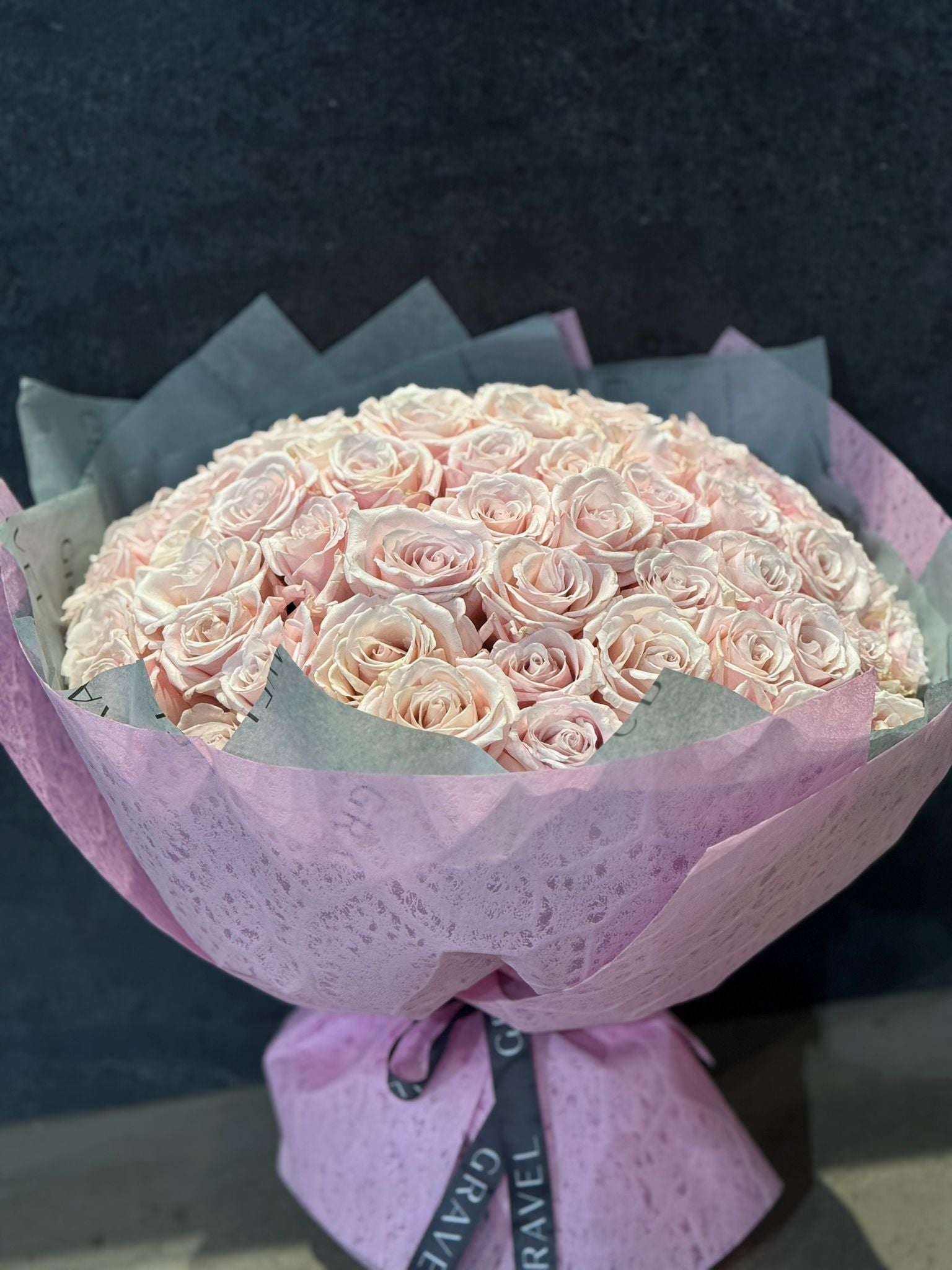 75 Pink Eskimo Roses Valentine's Day Hand Bouquet