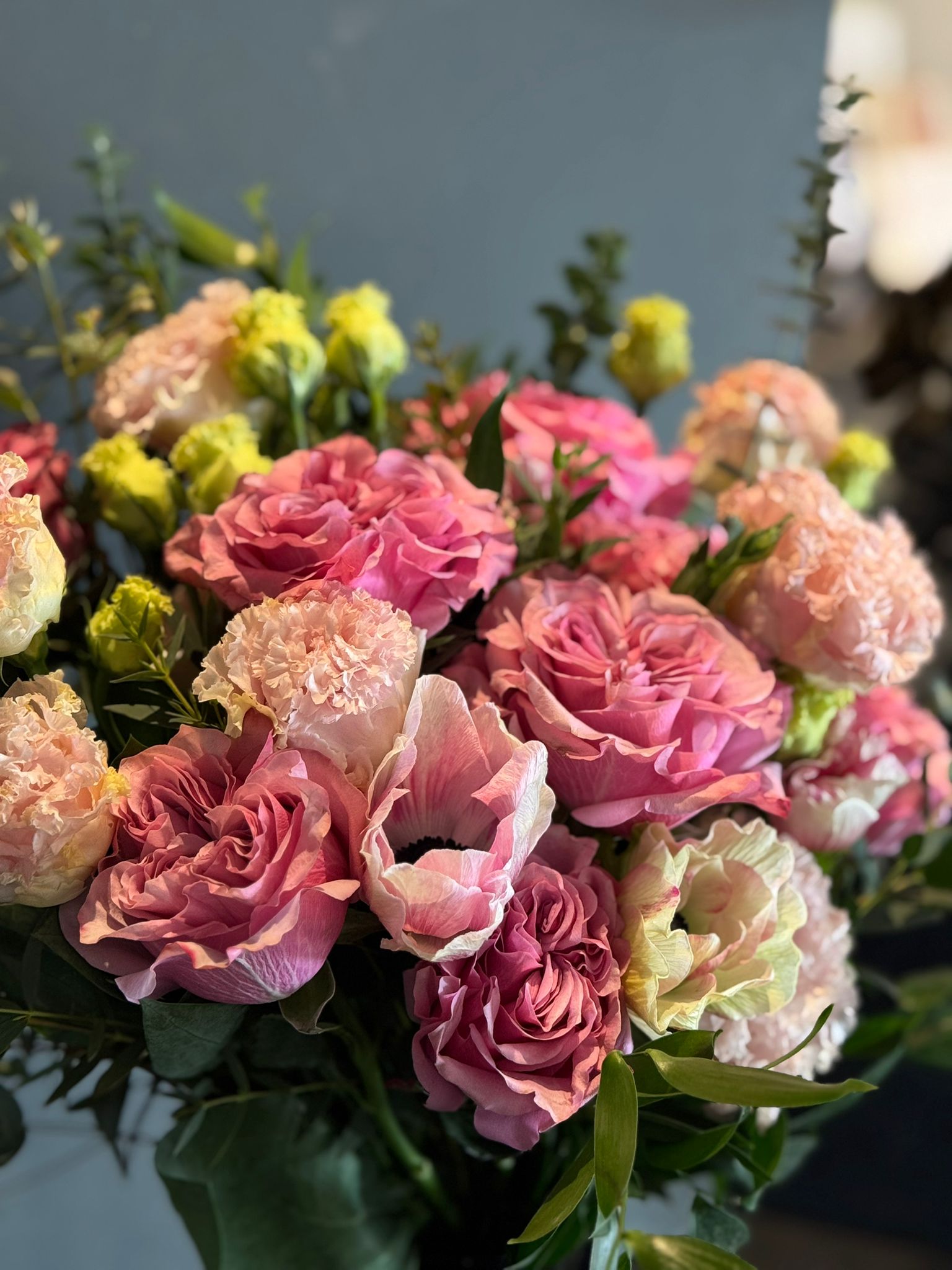 Pink Garden Roses, Pink Animons, Light Pink Lisianthus, and Italian Ruscus Hand Bouquet