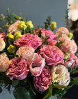 Pink Garden Roses, Pink Animons, Light Pink Lisianthus, and Italian Ruscus Hand Bouquet