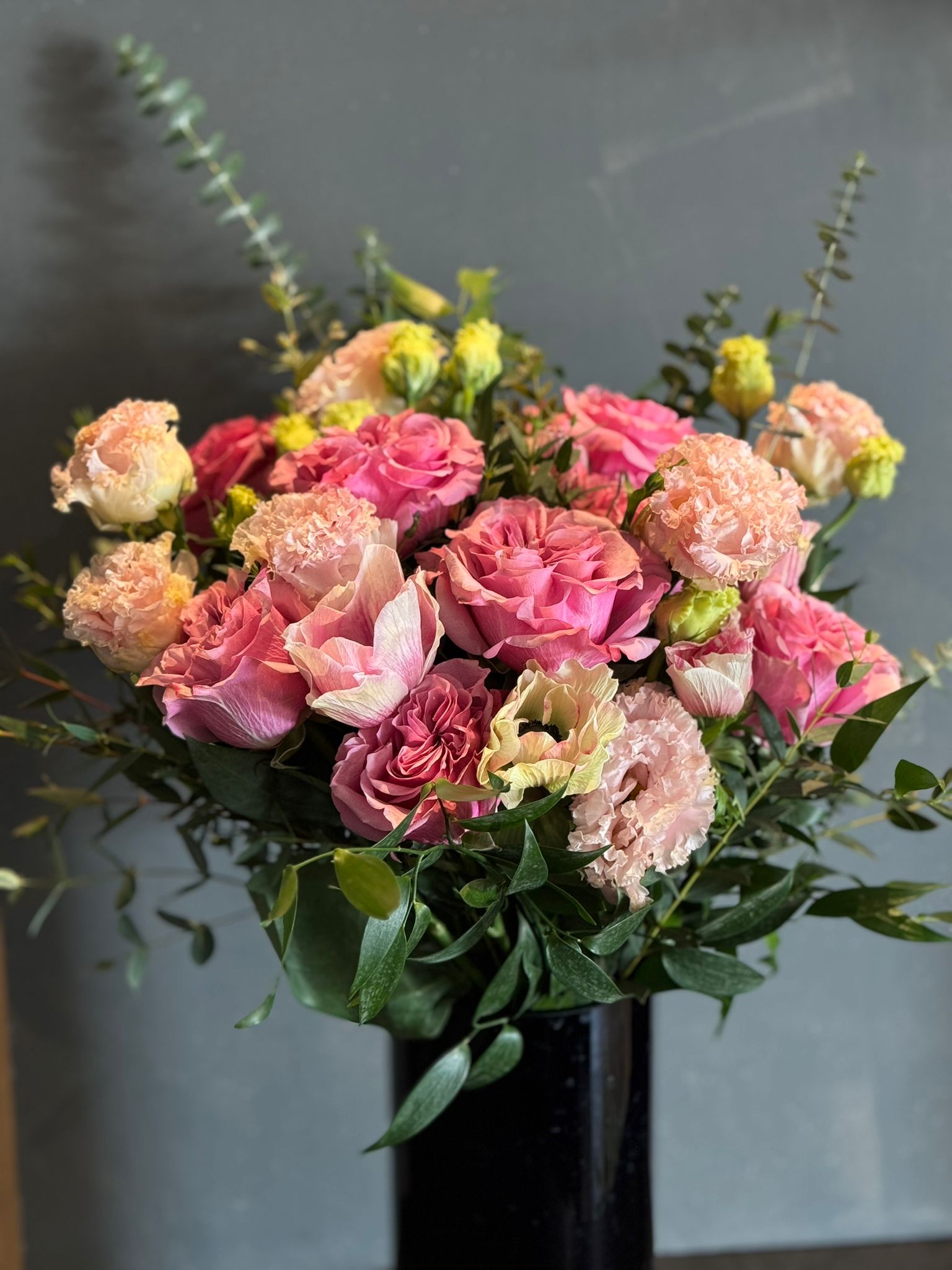 Pink Garden Roses, Pink Animons, Light Pink Lisianthus, and Italian Ruscus Hand Bouquet