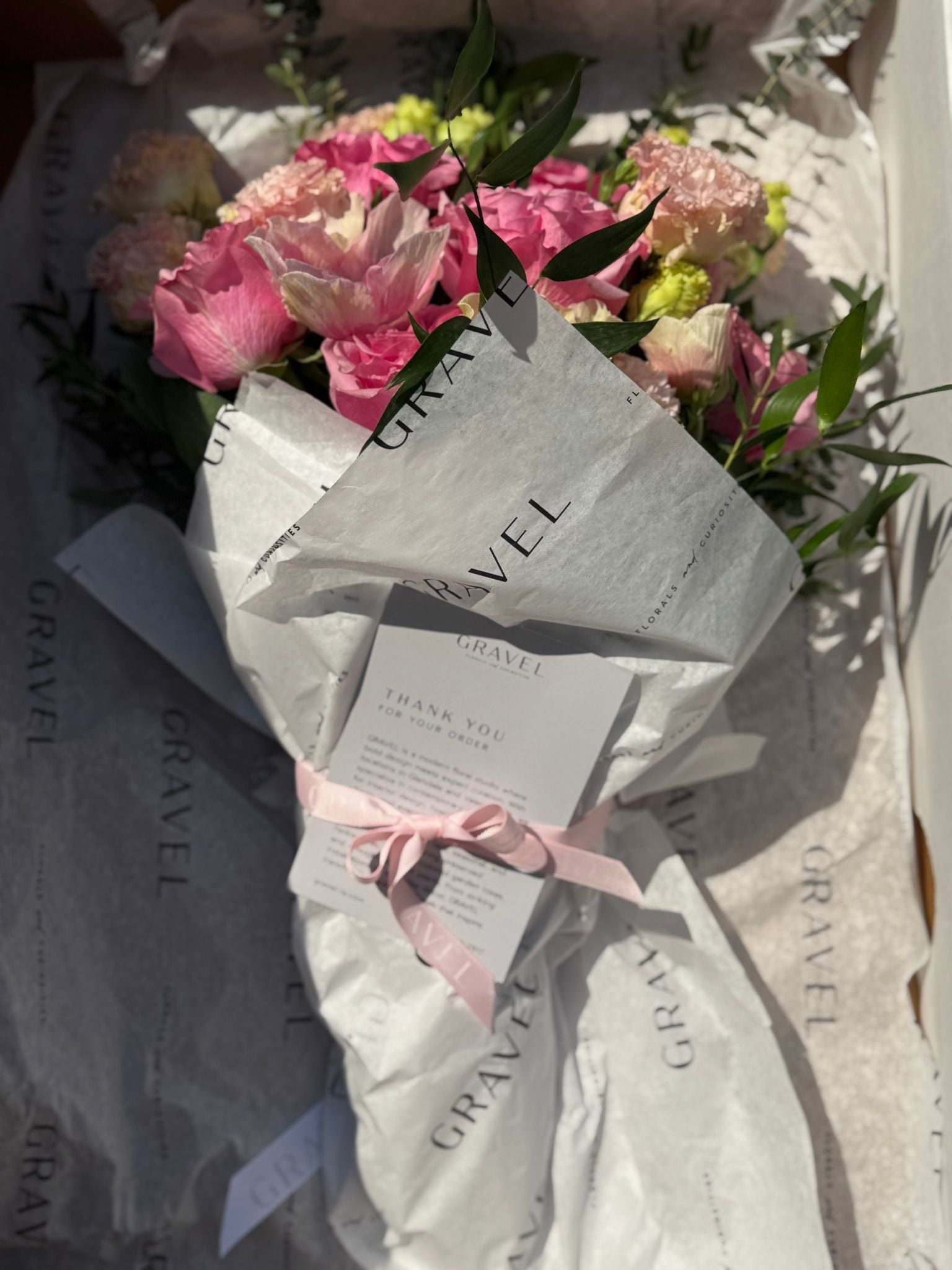 Pink Garden Roses, Pink Animons, Light Pink Lisianthus, and Italian Ruscus Hand Bouquet